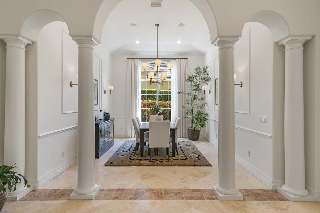 1710 Lake Club Court: the dining room seen through the columned opening