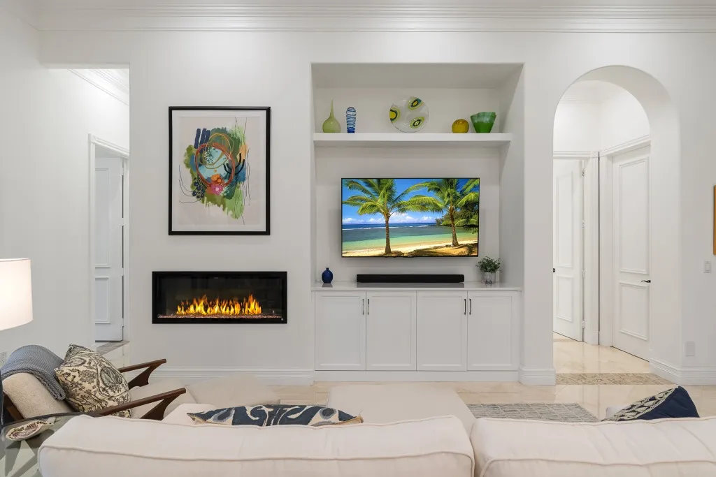1710 Lake Club Court: the family room, with the custom fireplace feature wall