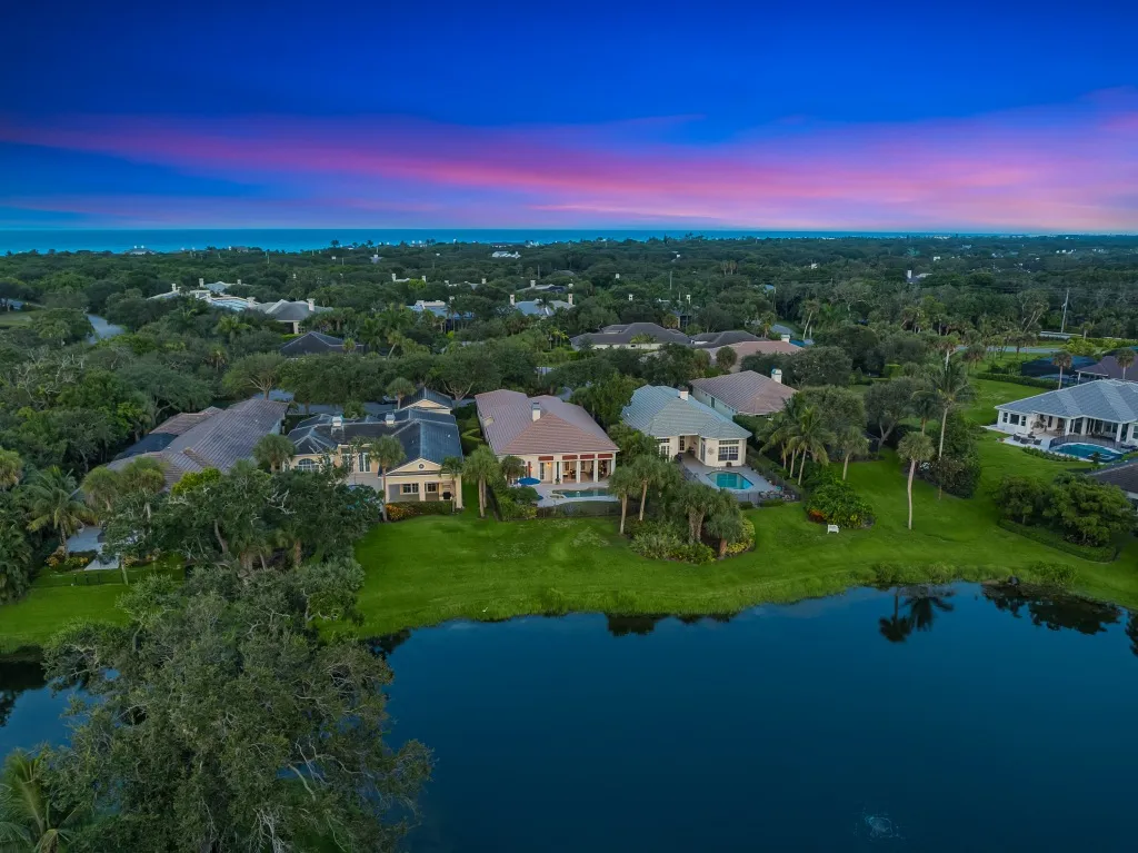 1710 Lake Club Court: an aerial over the lake at twilight