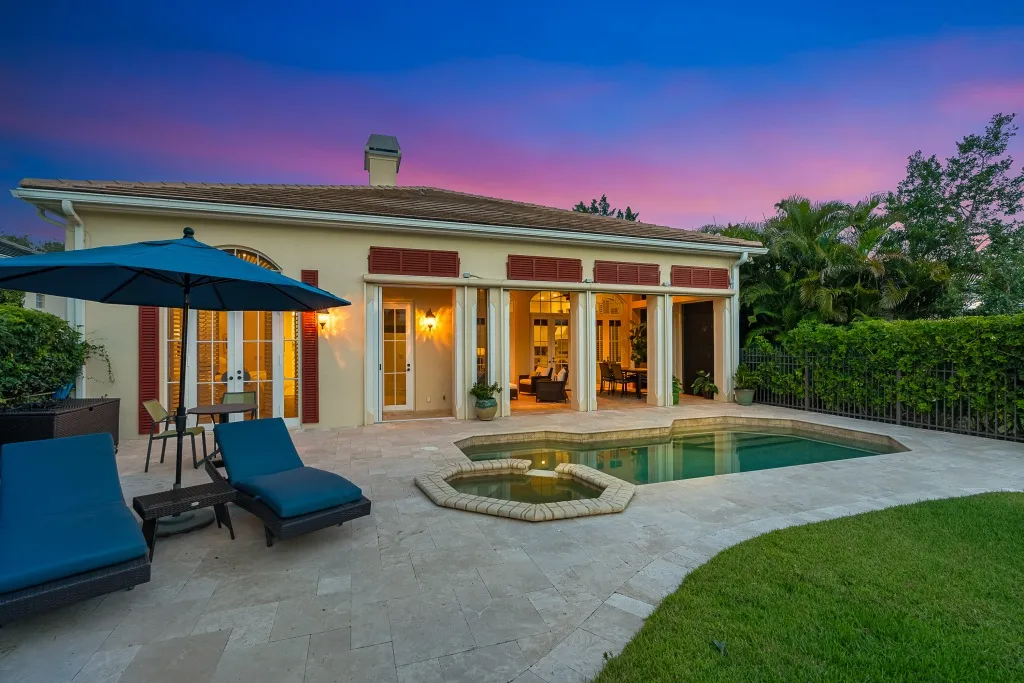 1710 Lake Club Court: the rear elevation and pool at twilight