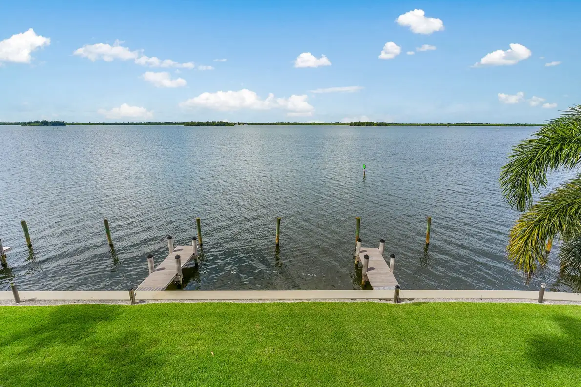 1776 Mooringline Drive, PH-C: the private dock and seawall, with capacity for a boat up to 20 feet