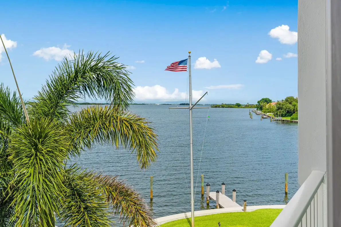 1776 Mooringline Drive, PH-C: palms and open water from the terrace