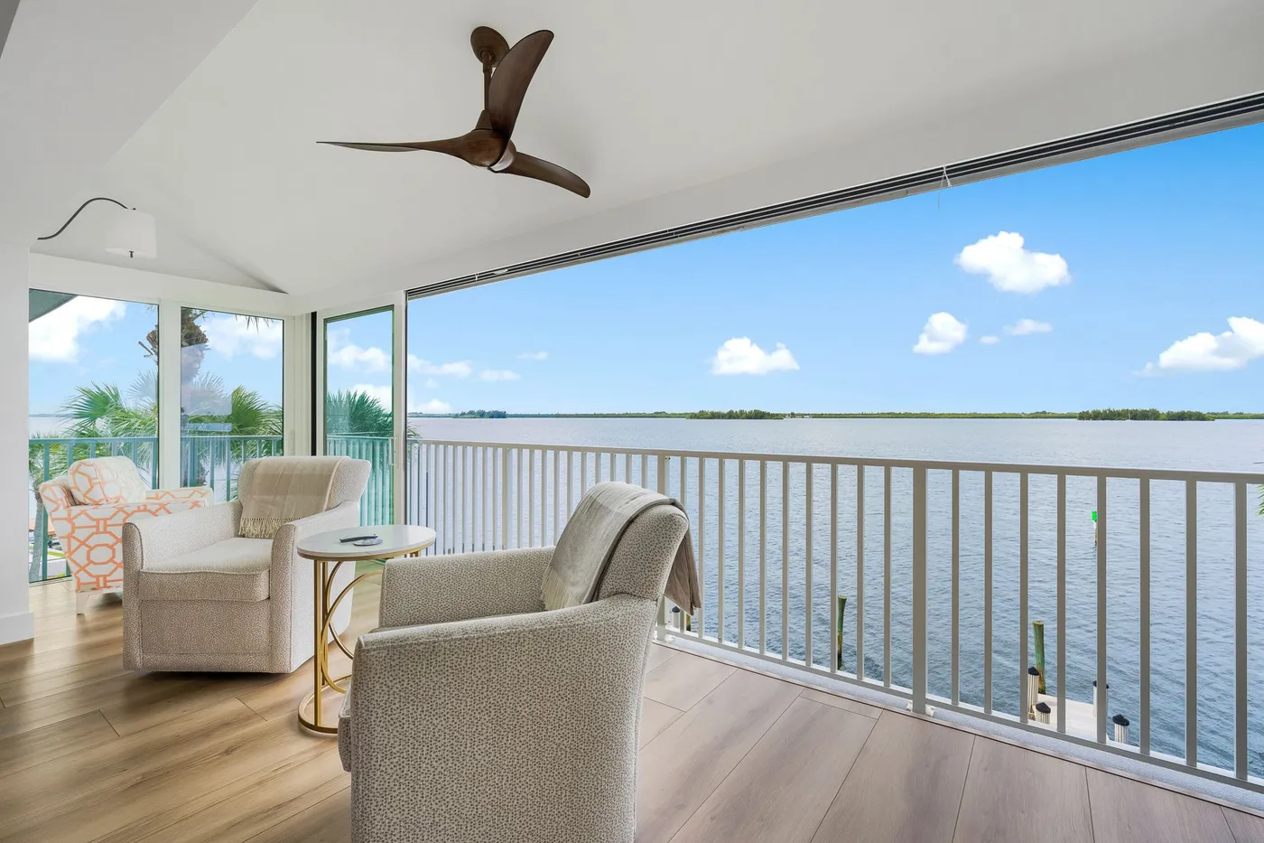 1776 Mooringline Drive, PH-C: the terrace looking out over the lagoon under the vaulted ceiling