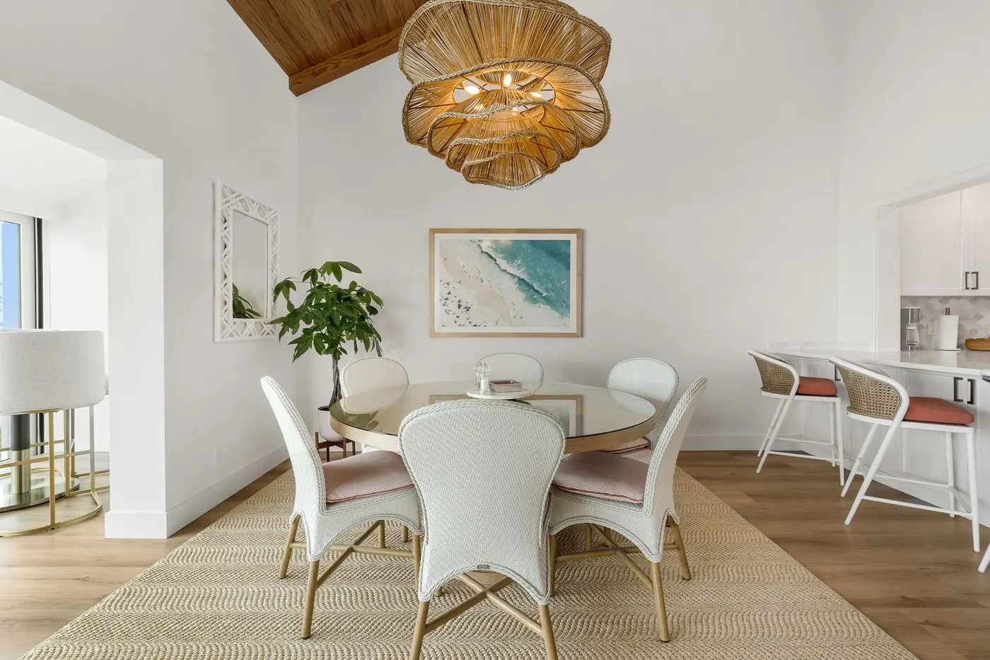 1776 Mooringline Drive, PH-C: the dining area beneath its woven pendant