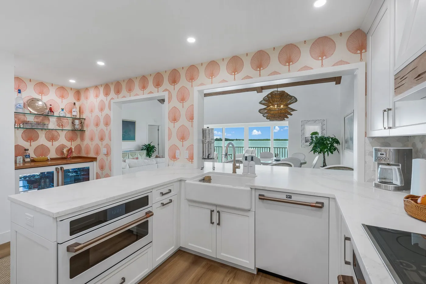 1776 Mooringline Drive, PH-C: the kitchen, with the water visible past the pass-through
