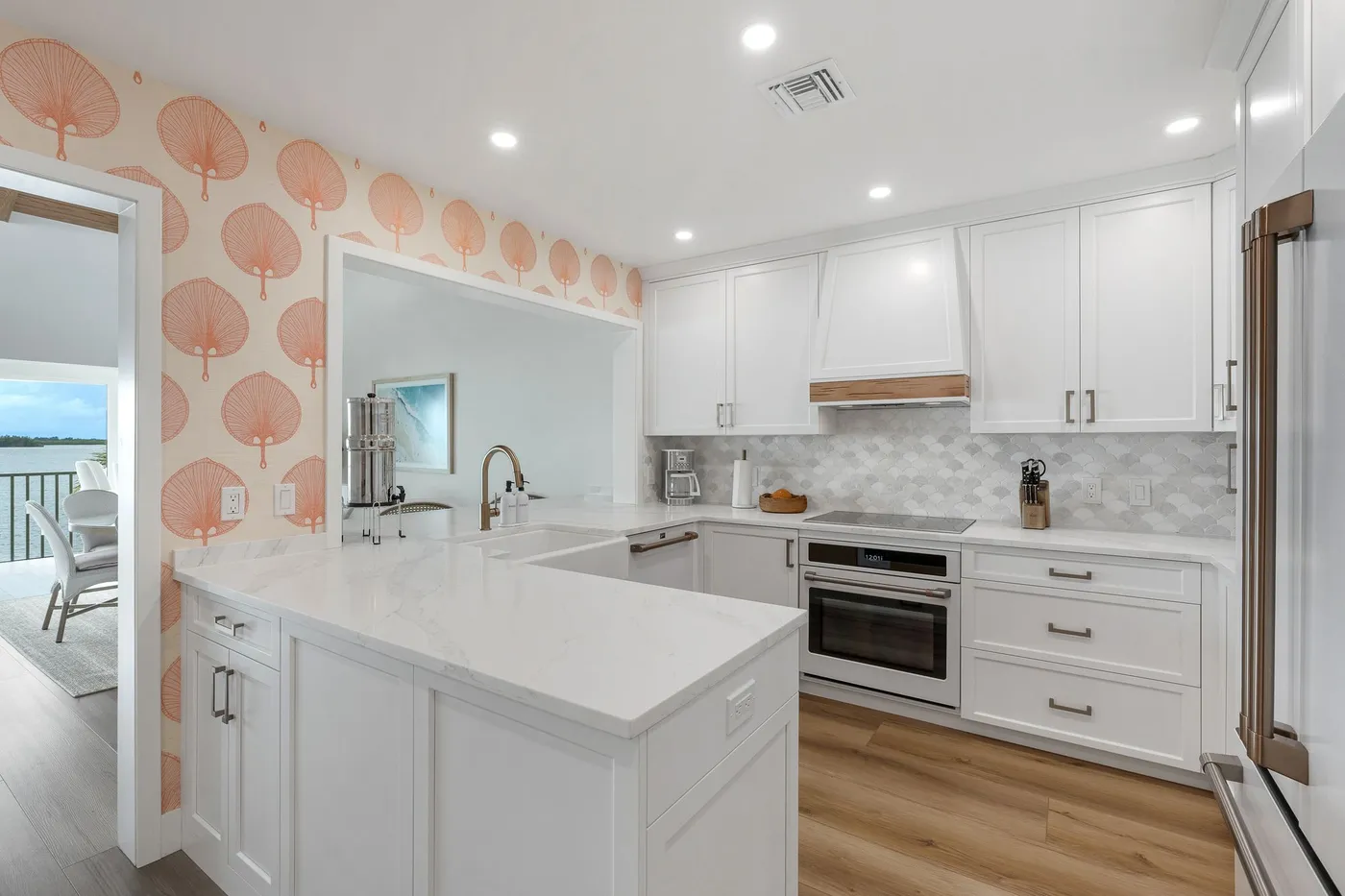 1776 Mooringline Drive, PH-C: the full kitchen: custom cabinetry, quartz counters and Meg Braff wallcovering