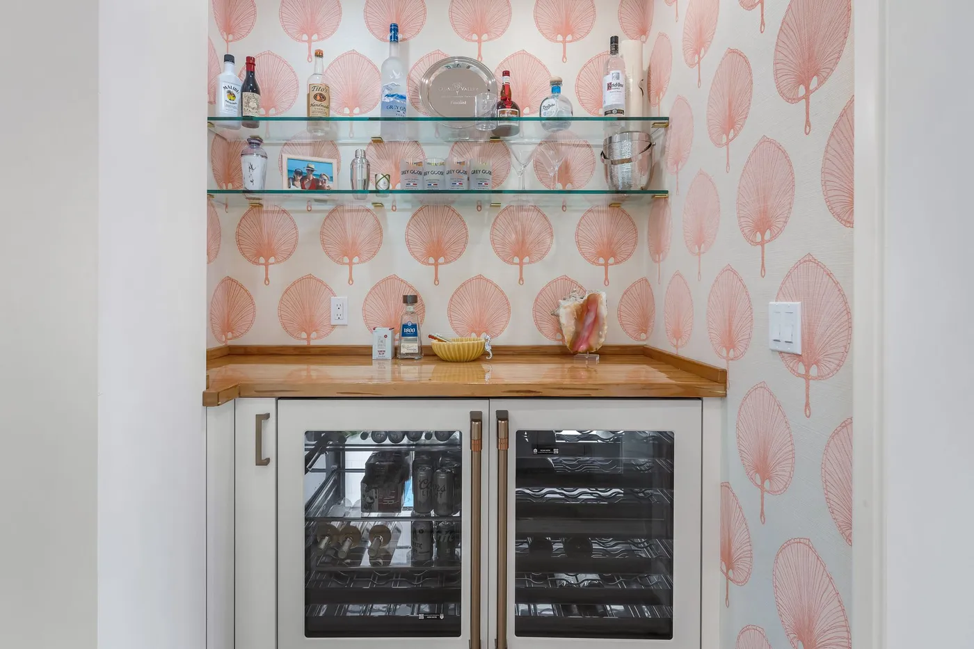1776 Mooringline Drive, PH-C: the bar with wine and beverage coolers beneath a cypress counter