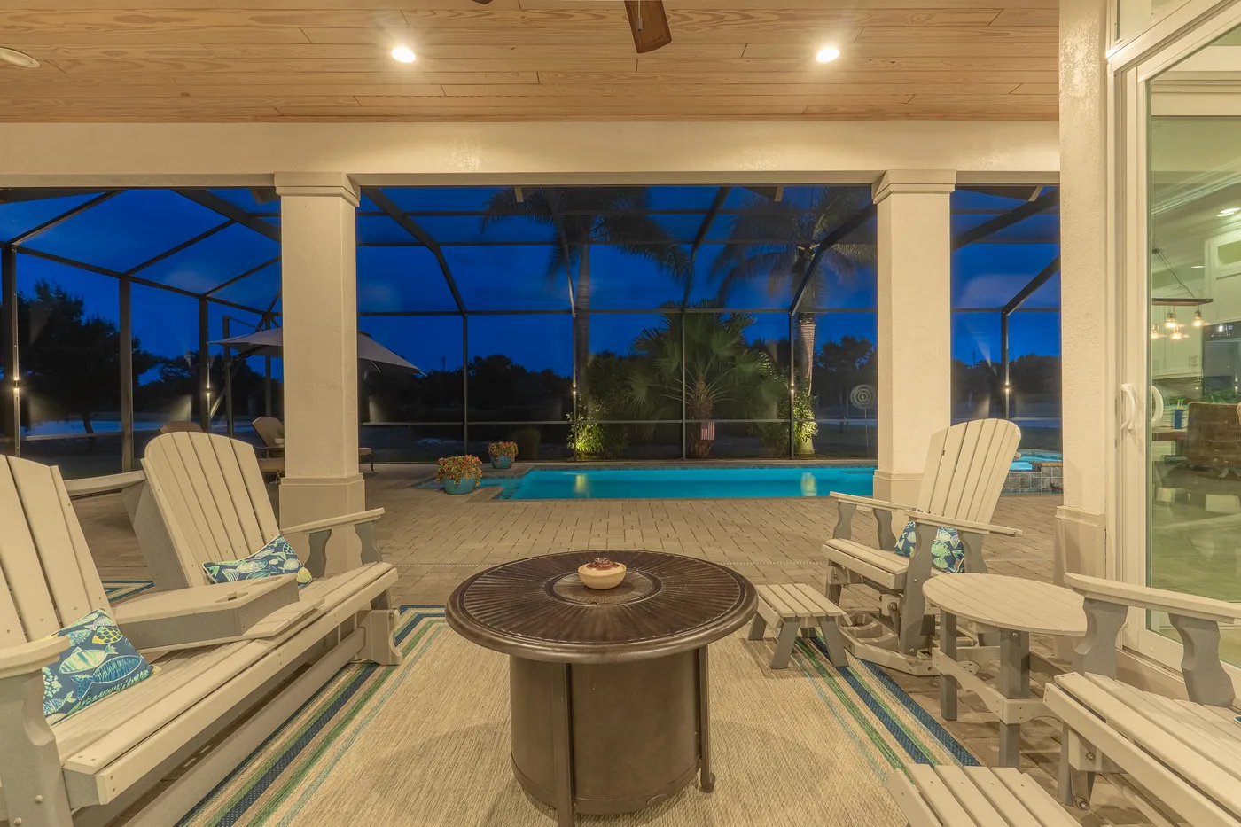 2340 Pine Valley Road: the lanai at twilight, looking out to the golf course